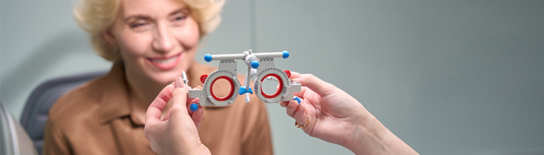 woman with optician's glasses at an eye test