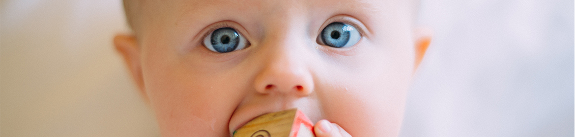Baby with blue eyes close up