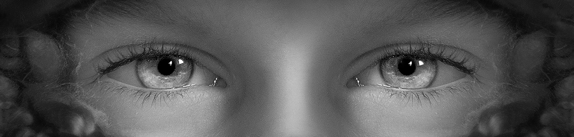 Close up black and white photo of eyes