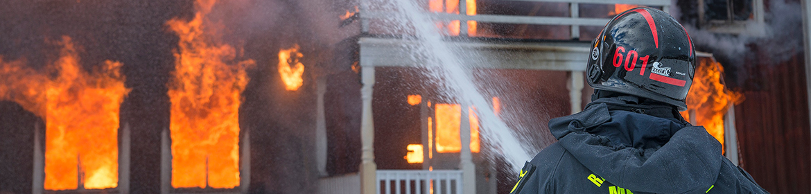 Firefighter putting out flames