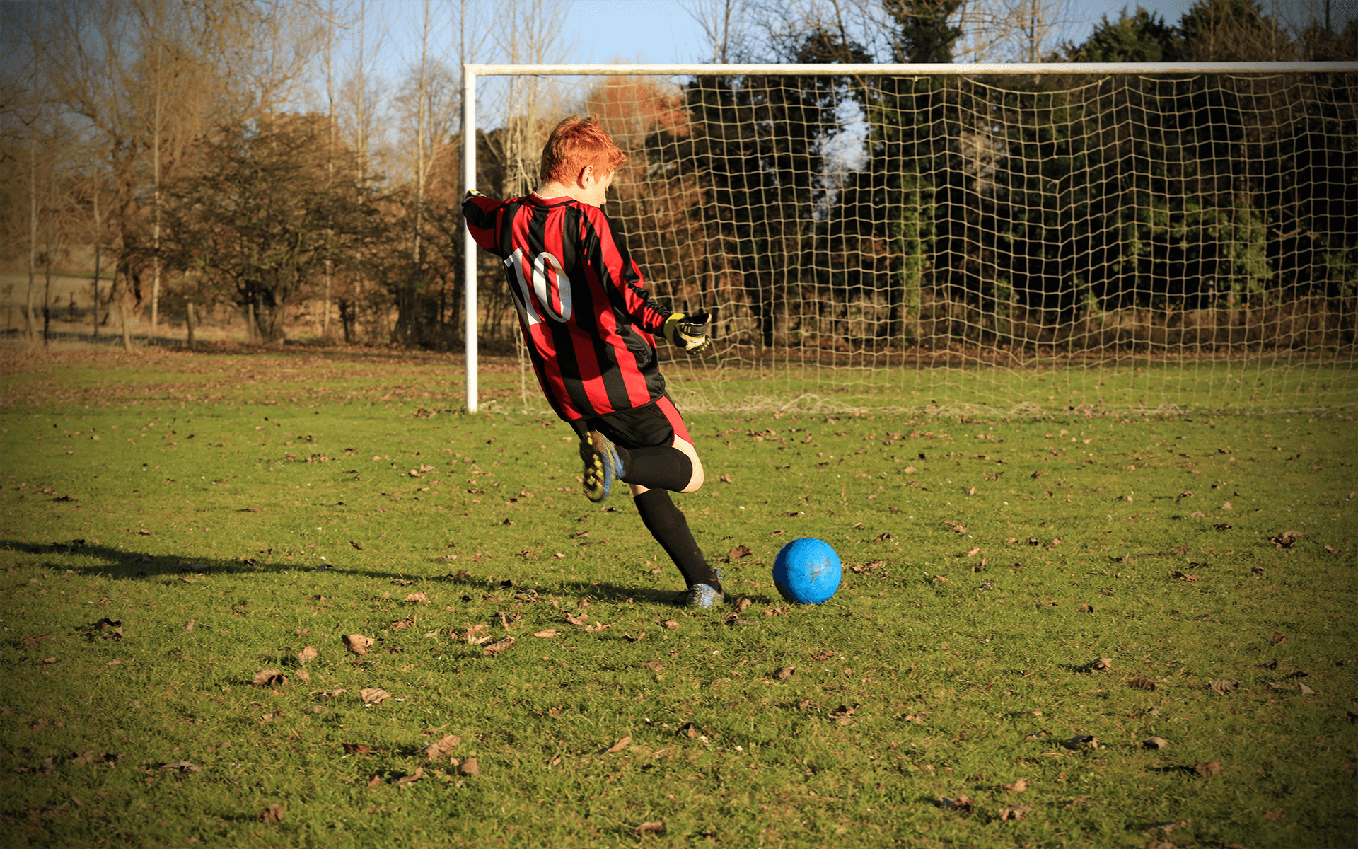 Boy playing football Early signs of Glaucoma