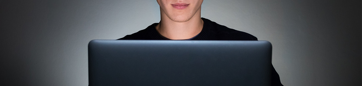 Man looking at laptop screen