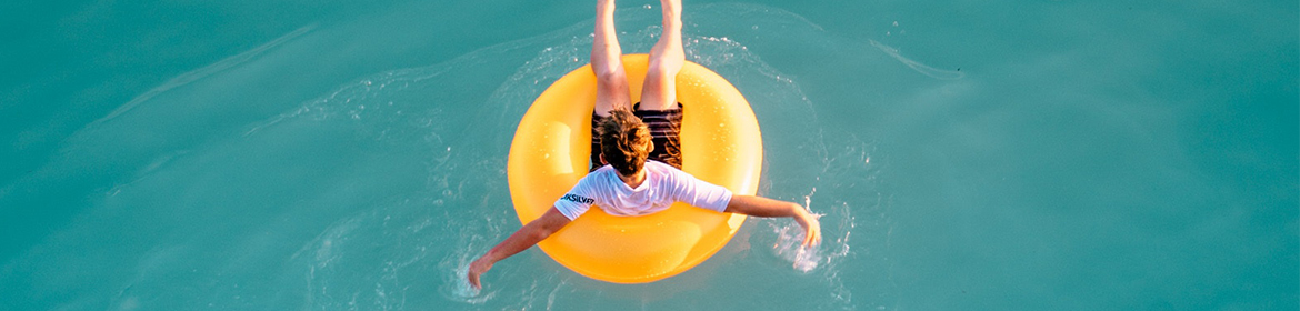 Person lying in inflatable ring