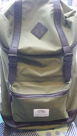 face in backpack