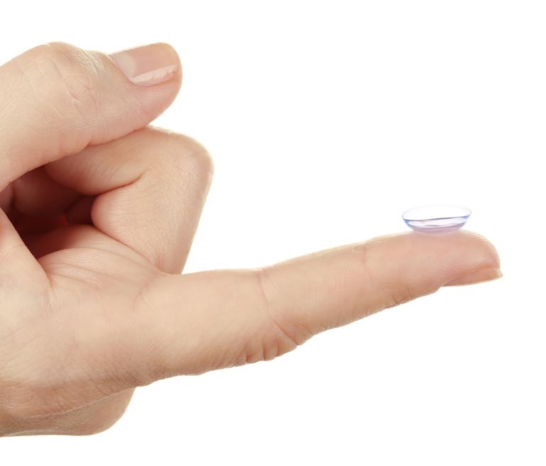 Side view of a contact lens on a finger