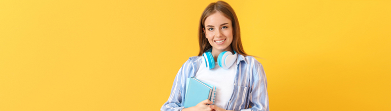 university student with book in arms