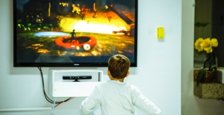 Child sitting in front of television