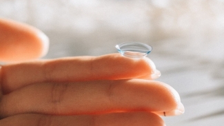 contact lens on fingertip