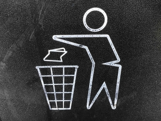 Throwing out trash in a recycling bin drawing