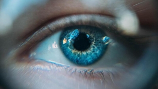 Slightly blurred close-up photo of a blue eye