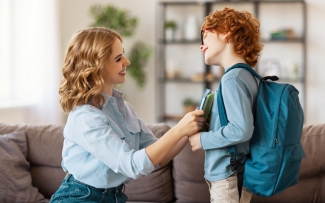 mom and son getting ready for school