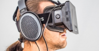 Man wearing headphones and oculus glasses