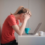 Women stressed at computer