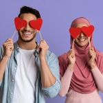 couple with hearts over their eyes with a purple background