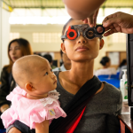 Mother and child at vision screening